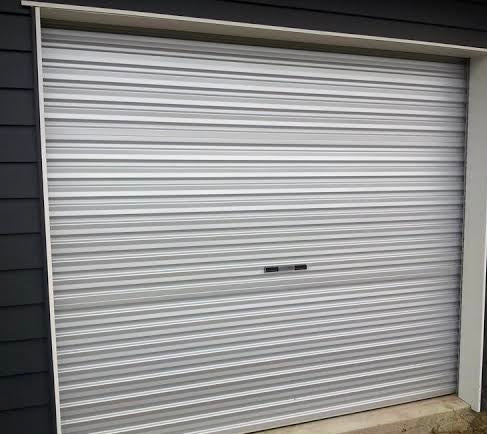 Metallic roller shutter door on a building facade